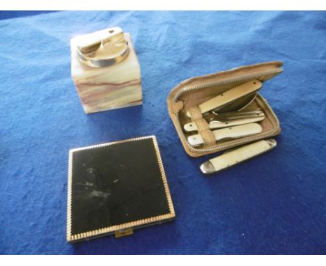 AN ONYX LIGHTER, COMPACT AND A CAMPAIGN SET OF CUTLERY