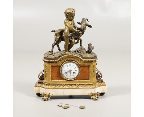 the enamel 4 1/2" dial on an eight day movement striking on a bell, stamped Japy Freres, the white marble and gilt case with 