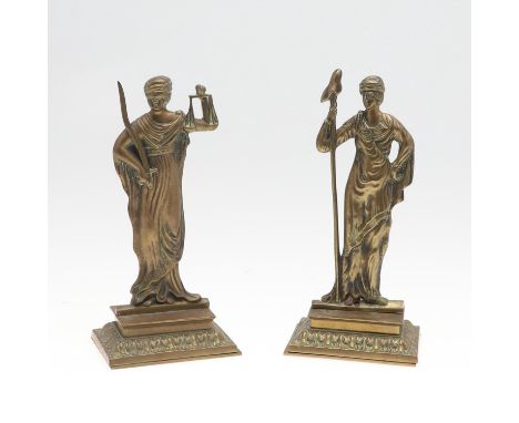 Justice blindfolded holding scales and a sword of truth, on foliate decorated bases, height 23cm. ** Both lightly rubbed and 