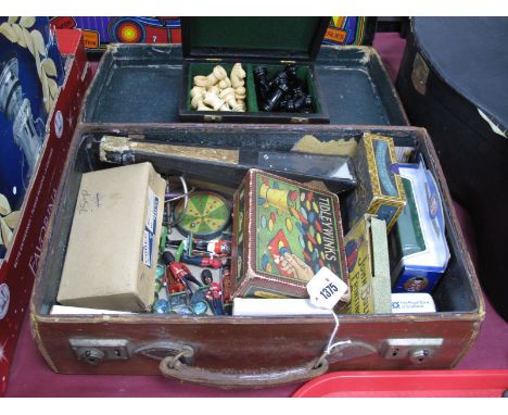 A Leather Case, containing vintage games and toys, including a Victorian kaleidoscope, a boxed Jacques chess set, toy soldier