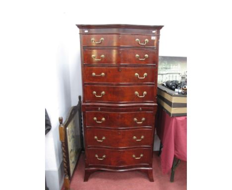 A XX Century Serpentine Shaped Chest on Chest, the top with four long drawers over a brushing slide bottom with three drawers