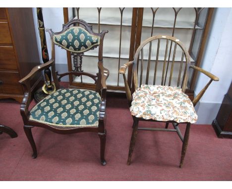 An Ercol Elbow Chair, together with an early XX Century mahogany salon chair, with a shaped top rail, upholsted back panel an