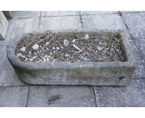A LARGE STONE TROUGH 35cm high x 111cm long x 53cm wide