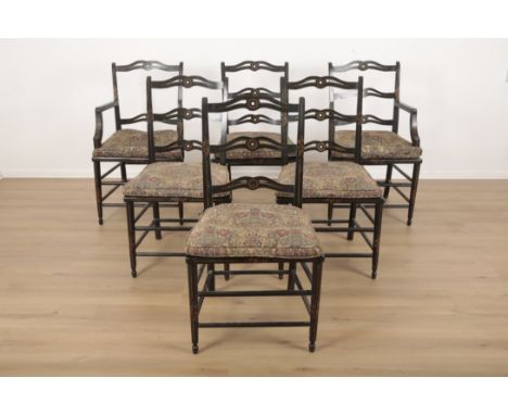 A SET OF SIX GEORGE III EBONISED AND PARCEL-GILT DINING CHAIRS 18th century and later, the pierced ladder backs over square c