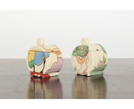 TWO CLARICE CLIFF BIZARRE BONJOUR PRESERVE POTS AND COVERS one example painted with green flowers, both 10.5cm high (2)
