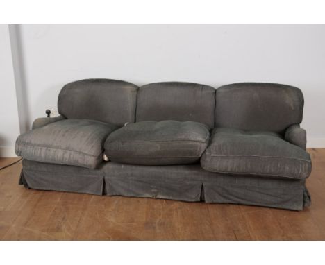 A GEORGE SMITH STYLE THREE-SEATER SOFA 20th century, with worn chenille covers, on turned front legs terminating in brass toe