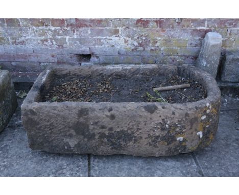 A LARGE STONE TROUGH 37cm high x 111cm long x 55cm wide