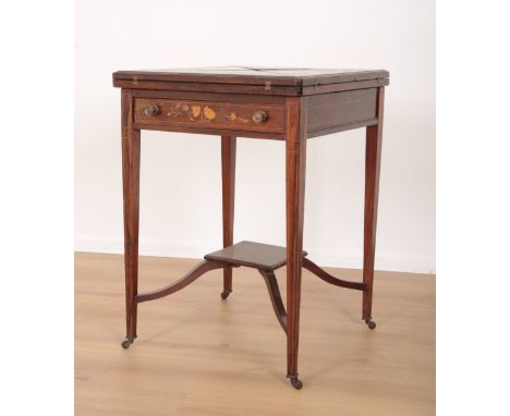 AN EDWARDIAN ROSEWOOD AND MARQUETRY ENVELOPE CARD TABLE the four leaves folding outward to reveal a green baize lined interio