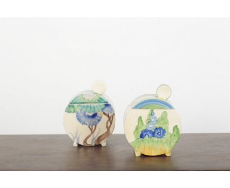 TWO CLARICE CLIFF BONJOUR PRESERVE POTS AND COVERS one example painted with flowers in the Sandon pattern, both 10.5cm high (