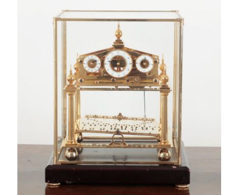 A BRASS CONGREVE CLOCK 20th century, with rolling ball fusee movement, a white hour dial, a minute dial and a second dial, in