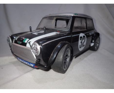 Tamiya radio controlled Mini Cooper fitted with pull start FS 12 Glow engine (good compression), very good condition, missing