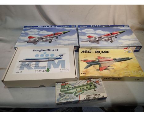 Five aircraft plastic kits comprising: two Trumpeter 1/72 scale flagons, R.V Aircraft 1/72 scale MIG 21, Airfix 1/72 scale Ve