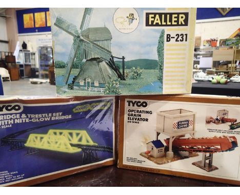 Three HO/OO scale railway related kits, motorised windmill, operating grain elevator and nite glow bridge, appear complete, u