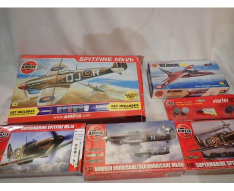 Five Airfix aircraft kits, 1/48 scale Spitfire, 1/72 scale Gnat, two Spitfire, and Hurricane, all appear complete, unchecked,