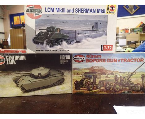 Three Airfix 1/72 scale military related kits, LCM and Sherman tank, Centurian tank, and Bofors gun and tractor, appear compl