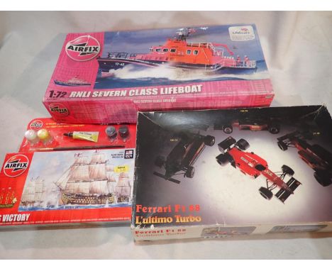 Three plastic kits, Airfix 1/72 scale Severn Class lifeboat, Airfix HMS Victory, and Protar 1/24 scale Ferrari F188, all appe