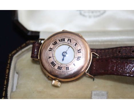 A lady's vintage 9ct gold cased half hunter wristwatch, having manual wind movement, dia.26mm, on leather bracelet 