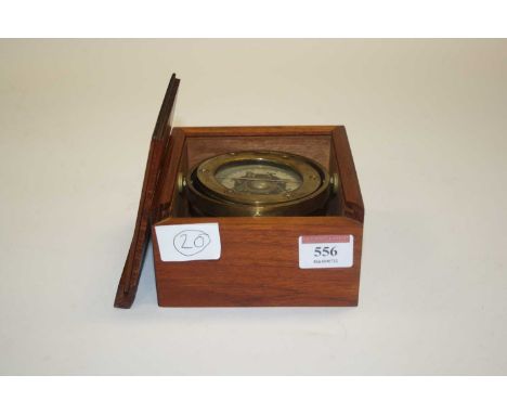 A reproduction brass ships compass, housed within a teak box, dia.9cm