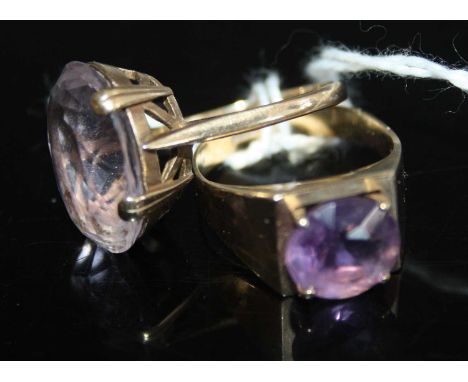 A modern 9ct gold amethyst set dress ring, size Q; together with one other having a large oval cut four-claw set amethyst, si