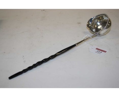 A 19th century silver toddy ladle, having ebonised handle, marks rubbed, 30.5cm long