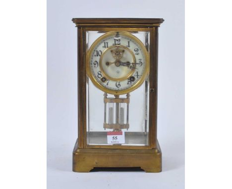 An early 20th century lacquered brass cased four-glass eight-day mantel clock, the enamelled chapter ring showing Arabic nume