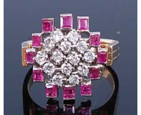 A yellow and white metal, ruby and diamond abstract cluster ring, comprising fourteen round brilliant cut diamonds claw set i