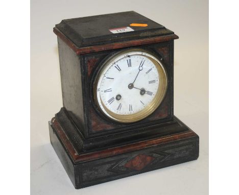 A Victorian black slate and rouge marble eight-day mantel clock, the enamelled dial showing Roman numerals, h.21cm