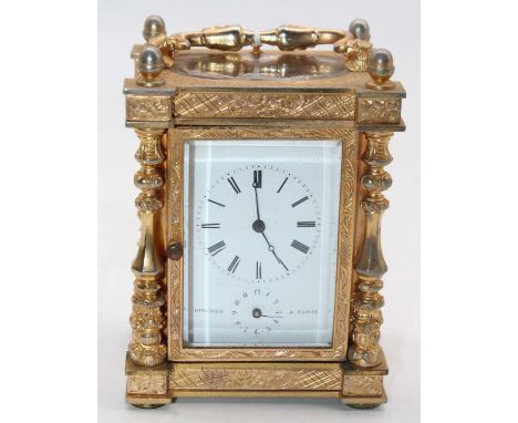 An early 20th century French gilt metal cased carriage clock, the enamelled dial showing Roman numerals and signed Pinchon a 