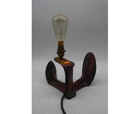 A cast iron shoe-last converted into a table lamp