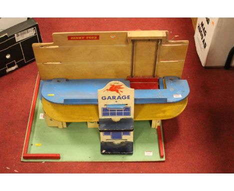 A 1960s painted model garage forecourt, with workshop
