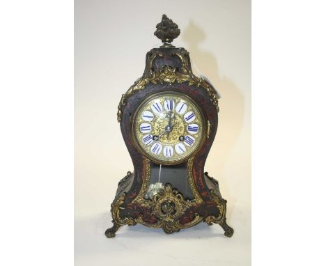 A 19th century French boulle inlaid eight-day mantel clock, having enamelled Roman numerals cartouches and Rococo gilt metal 