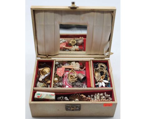 A vintage jewellery box containing costume jewellery, to include brooches and necklaces 