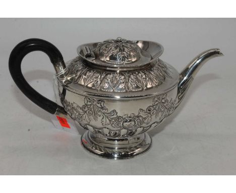 A Victorian silver teapot, repousse decorated with floral swags and bows, Birmingham 1892, 12.2oz gross, h.12.5cmReplacement 