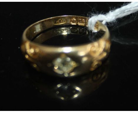 A vintage 18ct gold diamond ring, the illusion set round cut weighing approx 0.2 carats, to a tapering band with carved shoul