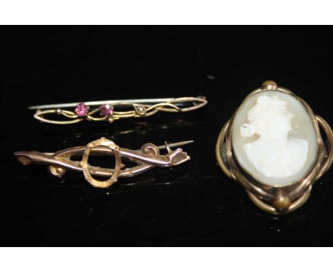A ladies ruby set 9ct gold hallmarked bar brooch (1.6g) together with a similar 9ct bar brooch (1.3g) &amp; cameo brooch (3) 