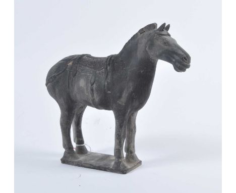 A Chinese hollow moulded black terracotta horse, modelled in standing pose with incised face and raised mane on a rectangular