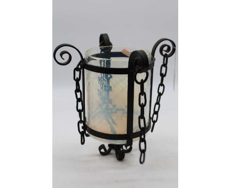An Arts &amp; Crafts style wrought iron framed ceiling light pendant having a cylindrical vaseline glass shade, height 26cm