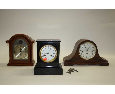 A Victorian black slate eight-day mantel clock, the enamelled dial showing Roman numerals, h.22.5cm; together with two other 