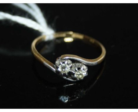 A vintage 18ct gold diamond crossover ring, the two round cuts each weighing approx 0.08 carats, 1.9g, size N 