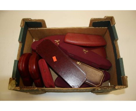 A collection of various vintage red jewellery boxes