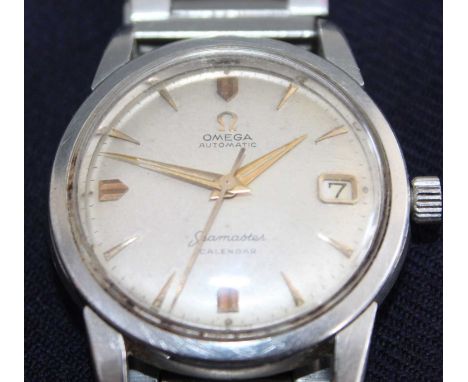 A vintage gent's Omega Seamaster automatic calendar steel cased wristwatch, having signed champagne dial with baton markers, 