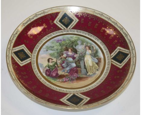 A Vienna porcelain cabinet plate, the centre painted with a Shakespearian scene, blue beehive mark verso, dia.29.5cm