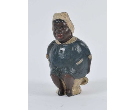 A vintage cast iron novelty 'Dilly brand laxatives' money-box, in the form of a lady relieving herself, h.20cm
