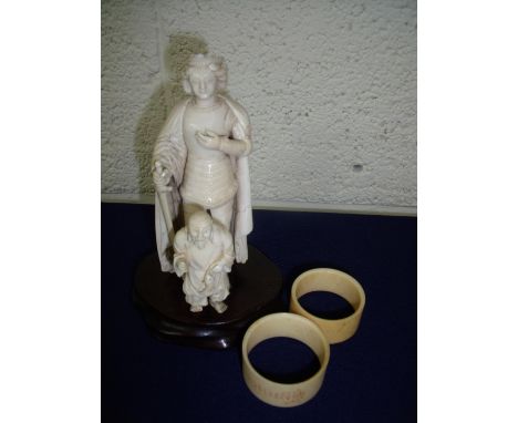 19th C carved ivory figure of a king (14.5cm high), another Netsuke type figure and two napkin rings 