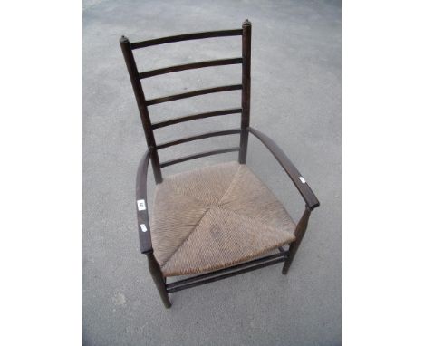 Early 20th C ladder back low rush seated armchair 