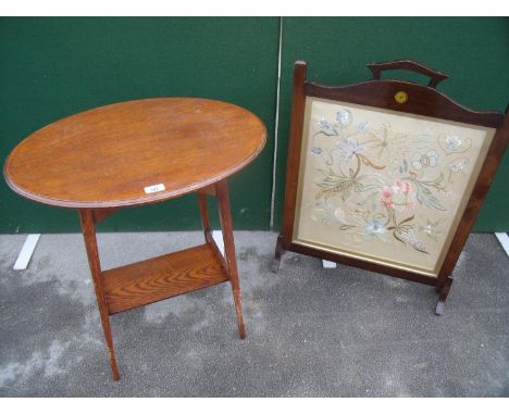Early 20th C oak occasional table with oval top and undertier and an early 20th C mahogany framed firescreen with inset silk 