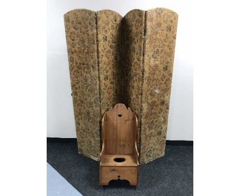 A child's rocking commode chair and a four way folding screen 