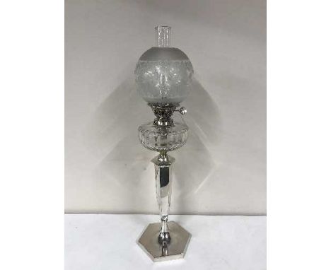 A good quality silver plated Evered & Co oil lamp with glass chimney and shade 