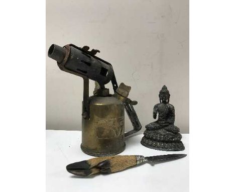 A bronze Buddha figure, vintage brass blow torch and a deer's hoof handled knife 