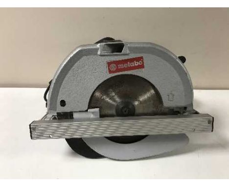 A Metabo saw, boxed Guide Pall and a Rexon ball roller 